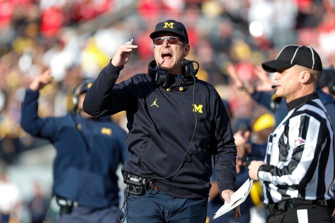 Suspension over, Jim Harbaugh returns to Michigan sideline picture picture