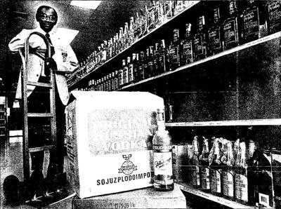 Robert Peele, ABC store manager in Norfolk's Downtown Plaza, shows where the store stocked Russian vodka before its removal.