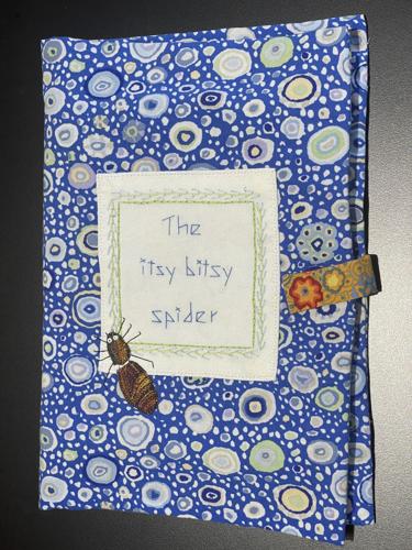 The itsy bitsy spider (front cover) by Jo Cowling (fabric book).jpeg