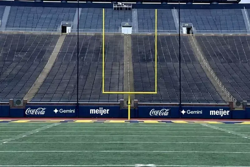 Michigan Stadium corporate sponsorships on the new scoreboards