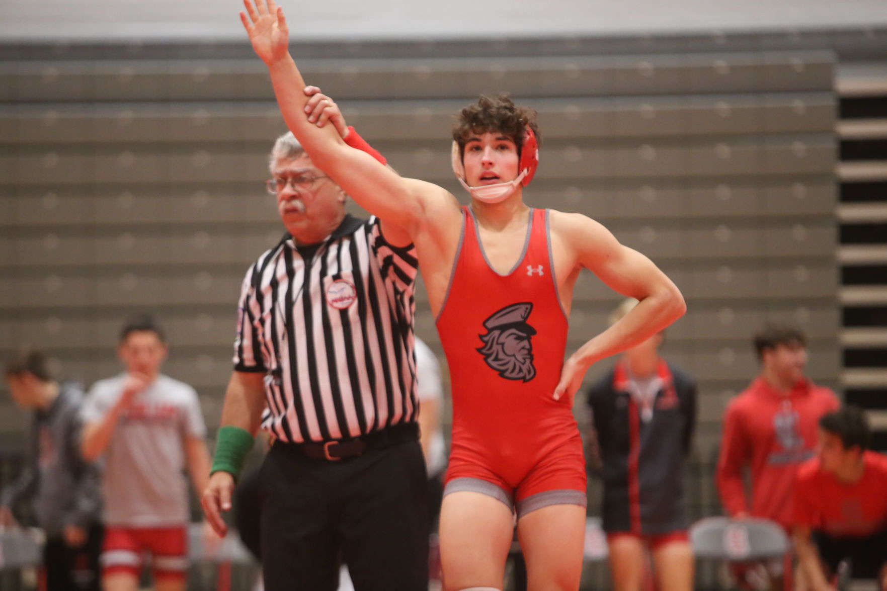 Trojan wrestlers grind out tight win over Spring Lake in early