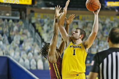 U-M's Hunter Dickinson pulls out of NBA draft for chance at ...
