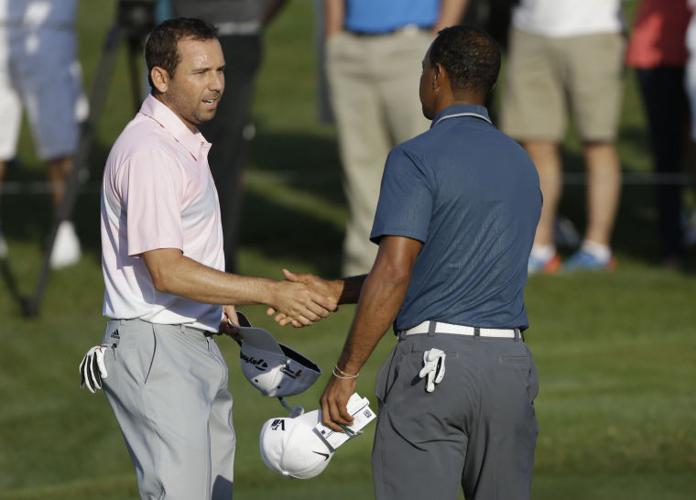 Sergio Garcia and Tiger Woods shake hands 051213