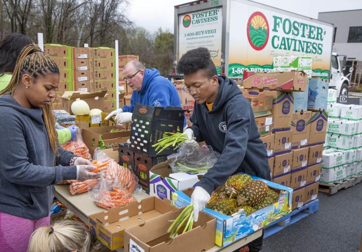 Crowds flock to produce giveaway at Daystar Church