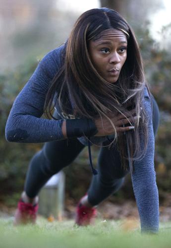 UNCG senior and professional bodybuilder Jasmine Williams leads a group workout at the Greensboro Arboretum