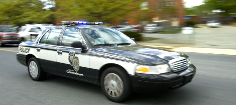 Greensboro police car in motion