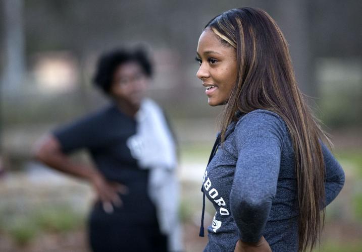 UNCG senior and professional bodybuilder Jasmine Williams leads a group workout at the Greensboro Arboretum