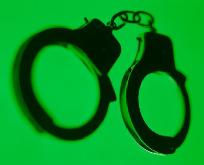 Handcuffs green background