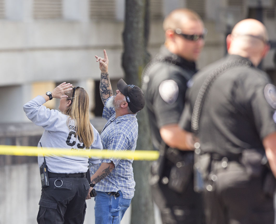 Update Police identify woman who jumped from parking garage (VIDEO