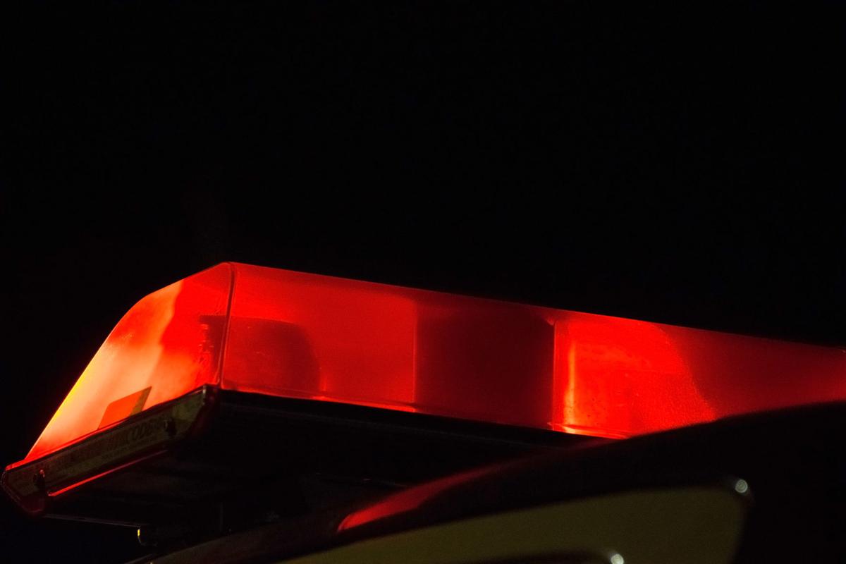 Red light flashing on emergency vehicle at night