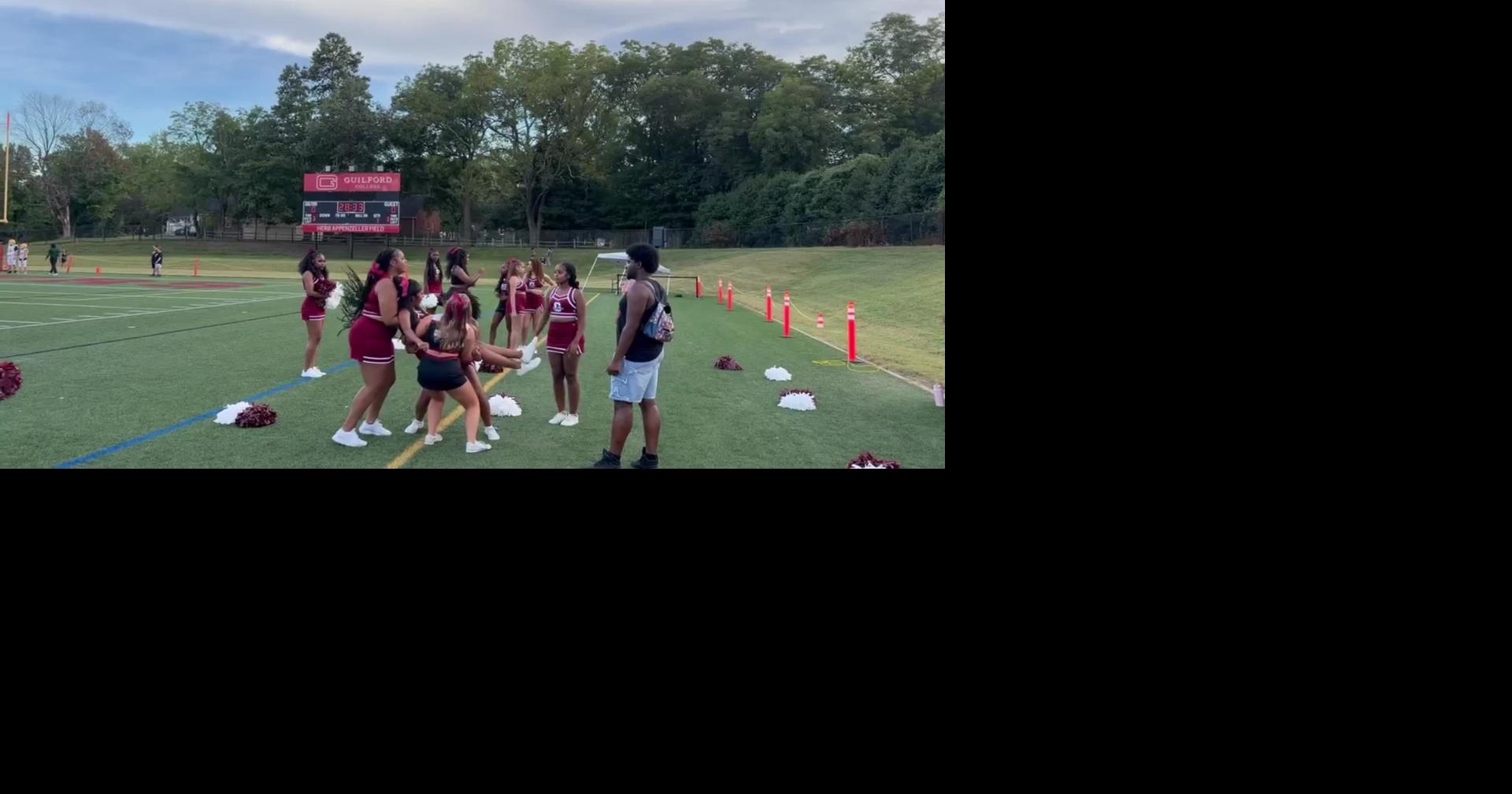 Guilford Quakers cheerleaders warm up for Methodist football game