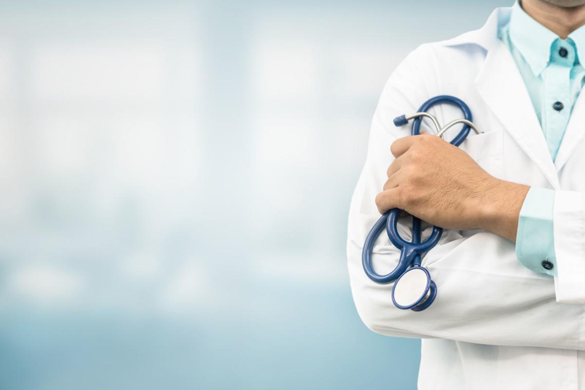 Doctor in hospital background with copy space. Healthcare and medical concept. (copy)