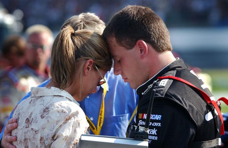 Ryan Newman prays with wife in May 2004