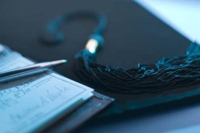 College mortarboard with checkbook