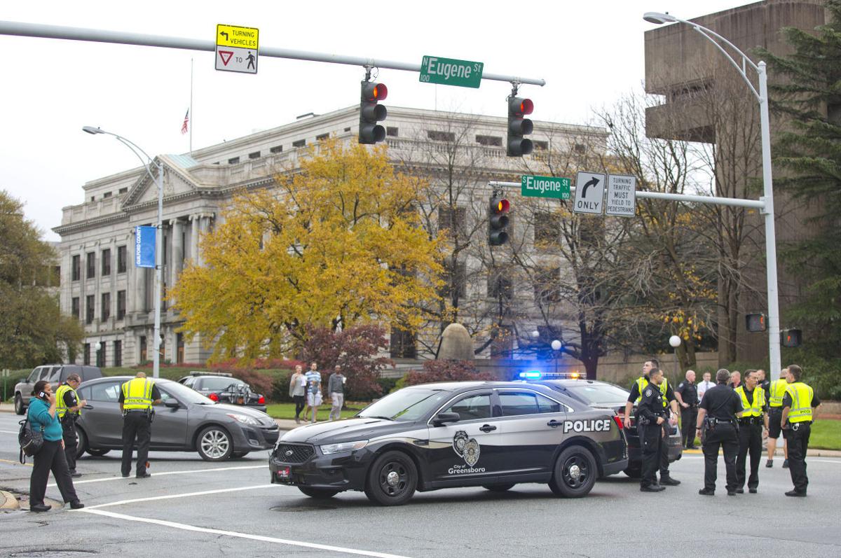 Pedestrian, officer, injured in wreck in downtown Greensboro (update