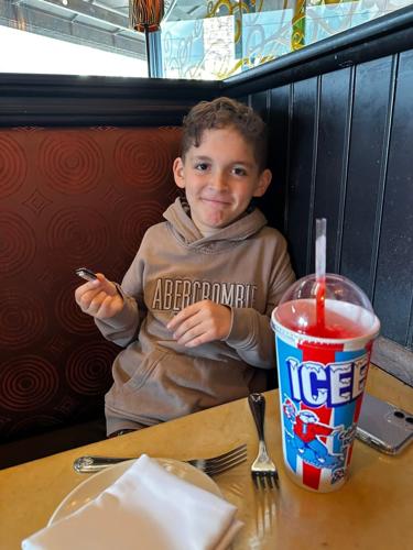 Jonah Reynolds is pictured at a restaurant in 2025.