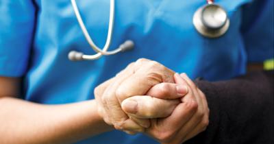 Doctor helping patient (copy) (copy)