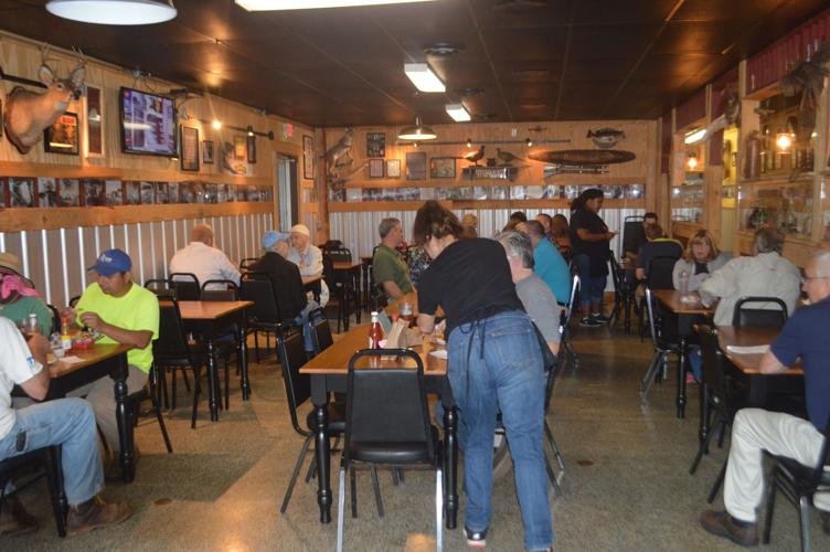 Local citizens fill the main dining area of Squealing Pig BBQ on Oct. 5. The restaurant has enjoyed early success since opening in late September.