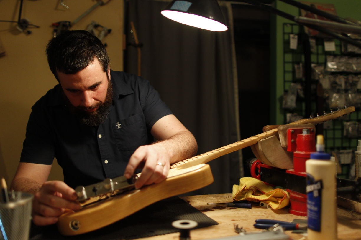 Musician gives new life to old guitars