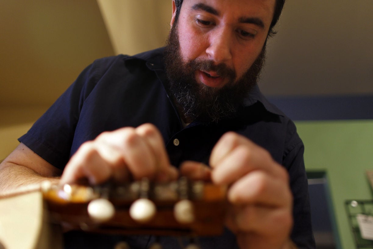 Musician gives new life to old guitars