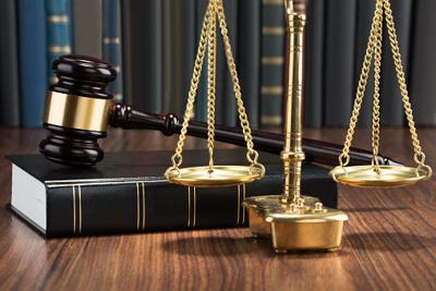Gavel On Book With Golden Scale
