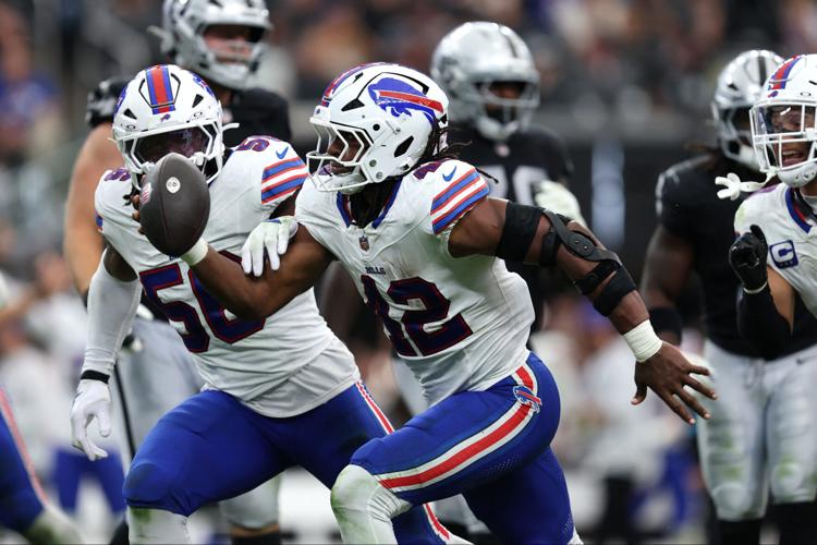Buffalo Bills linebacker Dorian Williams (42) reacts after an interception in the third quarter against the Las Vegas Raiders at Allegiant Stadium.
