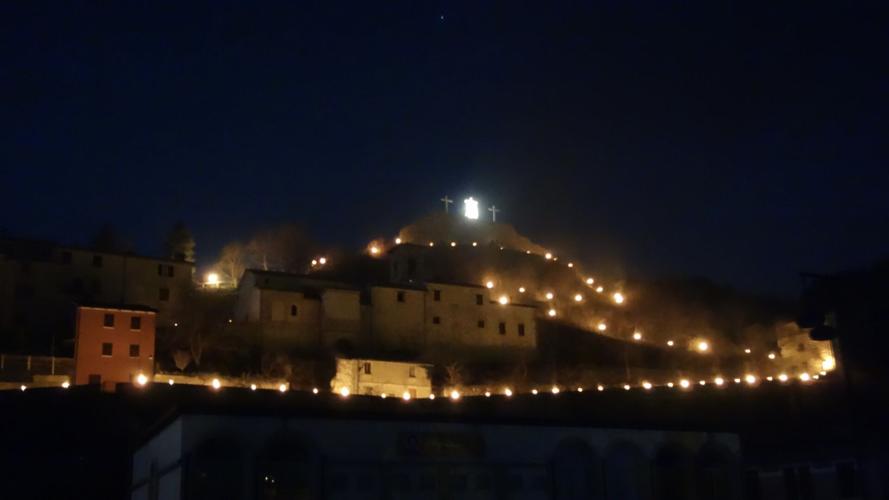 The dramatic finale of Cantiano's Passion Play leaves the center cross atop the town empty, save for a floodlit shroud blowing in the wind.