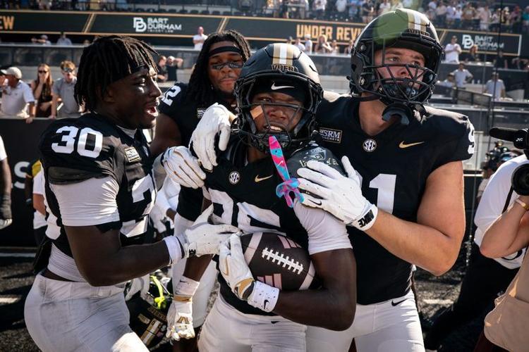 Vanderbilt cornerback Cayden Daniels (26) celebrates his game winning touchdown off of a NC State fumble during the final seconds of the fourth quarter at FirstBank Stadium in Nashville, Tenn., Saturday, Sept. 19, 2026.