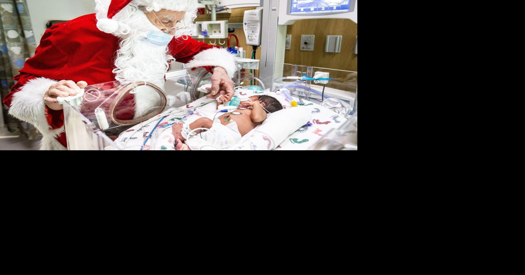 Santa, baby: The Man in Red makes special stop to visit newborns at Moses Cone
