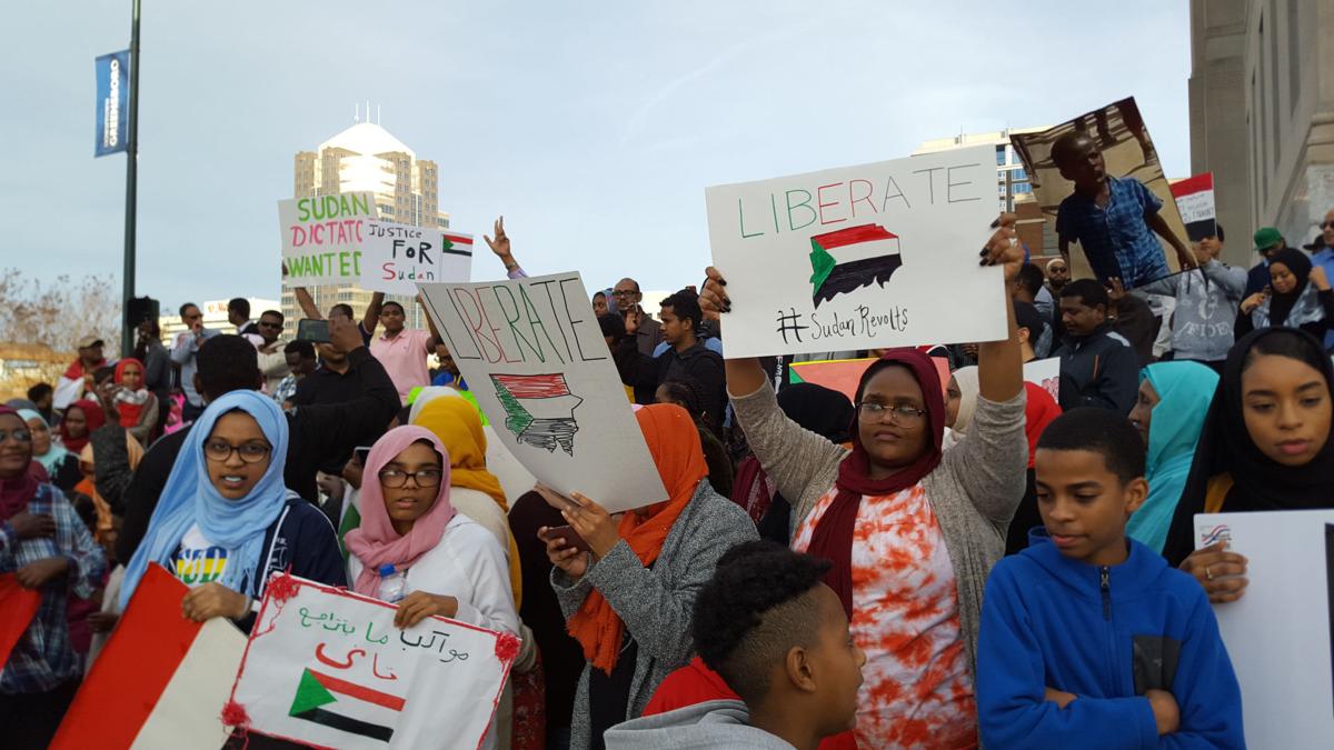 group protests sudanese leadership in downtown greensboro