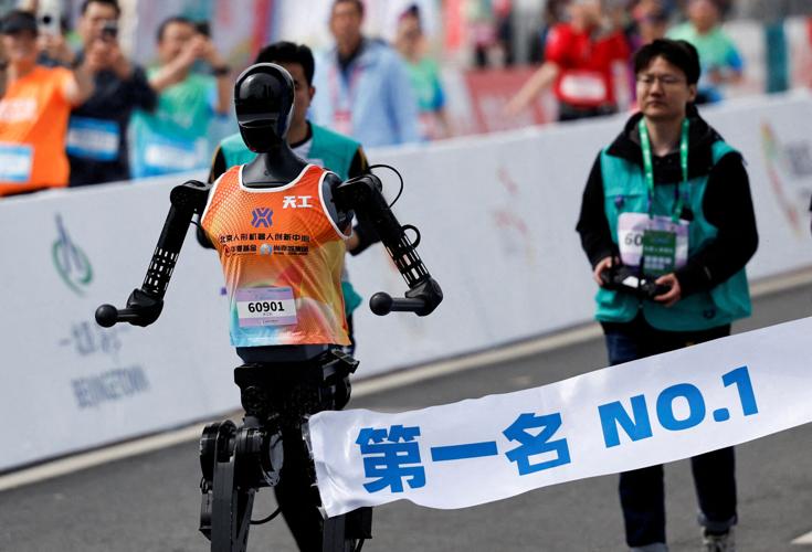 FILE PHOTO: E-Town Half Marathon & Humanoid Robot Half Marathon in Beijing