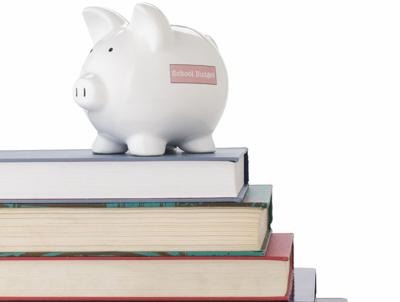 Piggy bank on school books FOR WEB