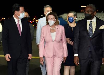 U.S. House Speaker Nancy Pelosi, with her delegation, arrives in Taiwan as she is welcomed by Taiwan Foreign Minister Joseph Wu, left, at Taipei Songshan International Airport, Tuesday, Aug. 2, 2022.