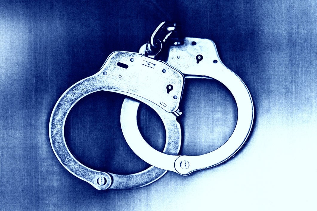Blue tone of locked handcuffs