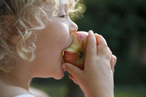 child eating apple graphic