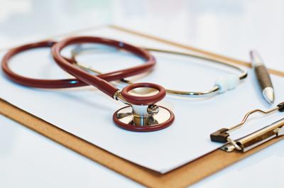stethoscope on top of folder in a laboratory (web only)