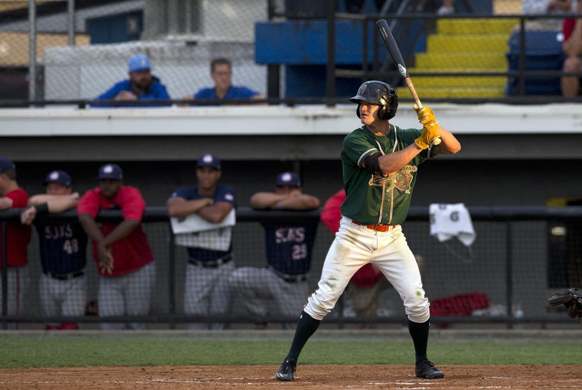 Hoppers' bluecollar Dalton Wheat holds bat with workman's gloves