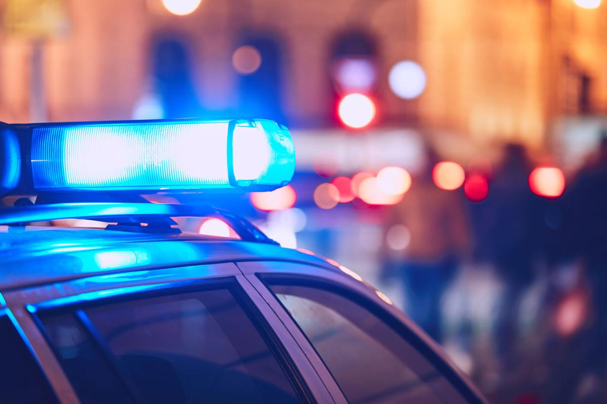 Blue flasher on the police car at night. (copy)