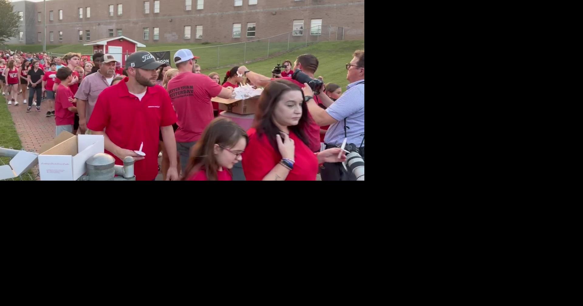 People enter gate at Caden Sorrell vigil