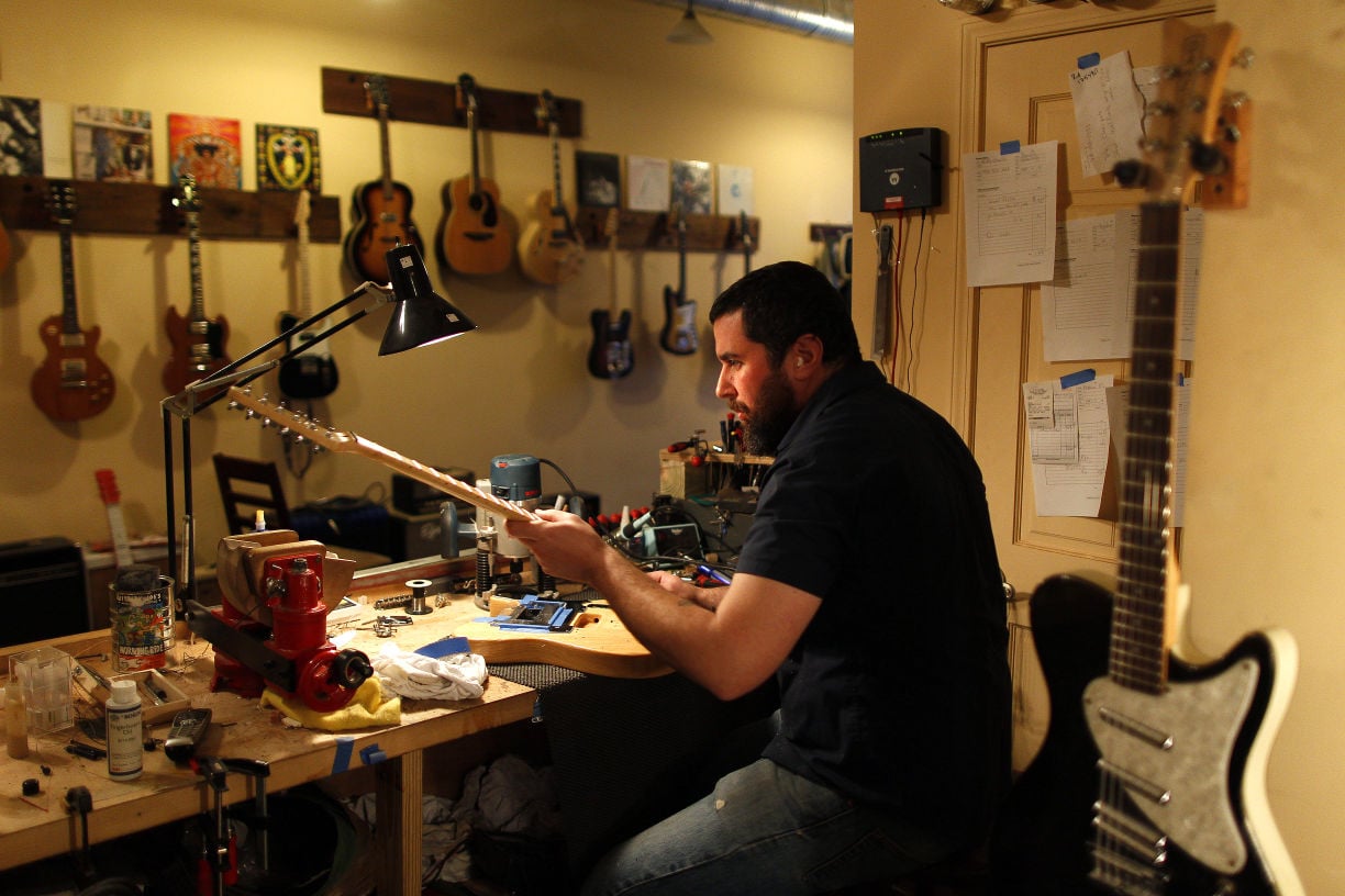 Musician gives new life to old guitars