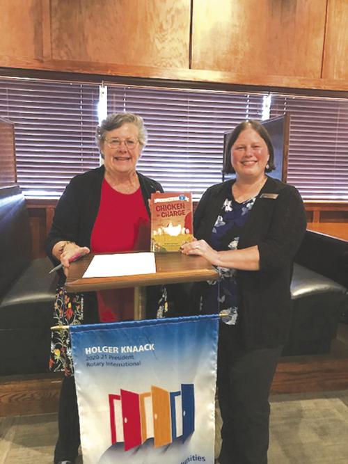 Marshall receives book for library