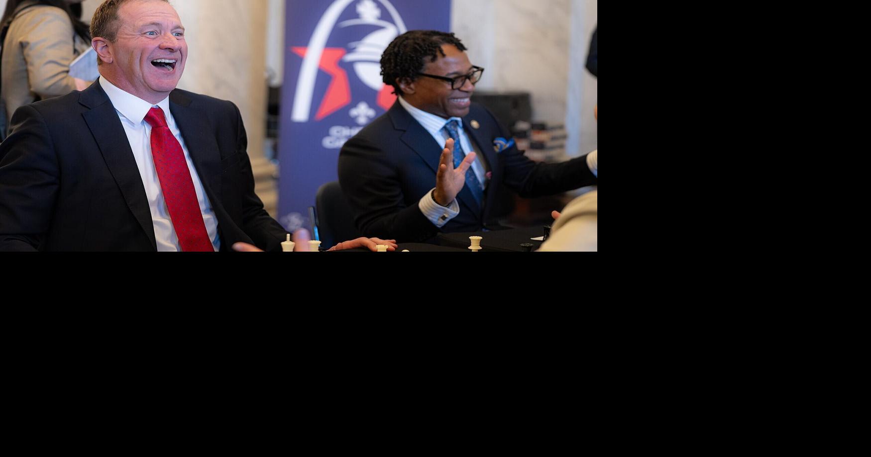 Sen. Eric Schmitt, R-Mo., left laughs with Rep. Wesley Bell, D-Mo