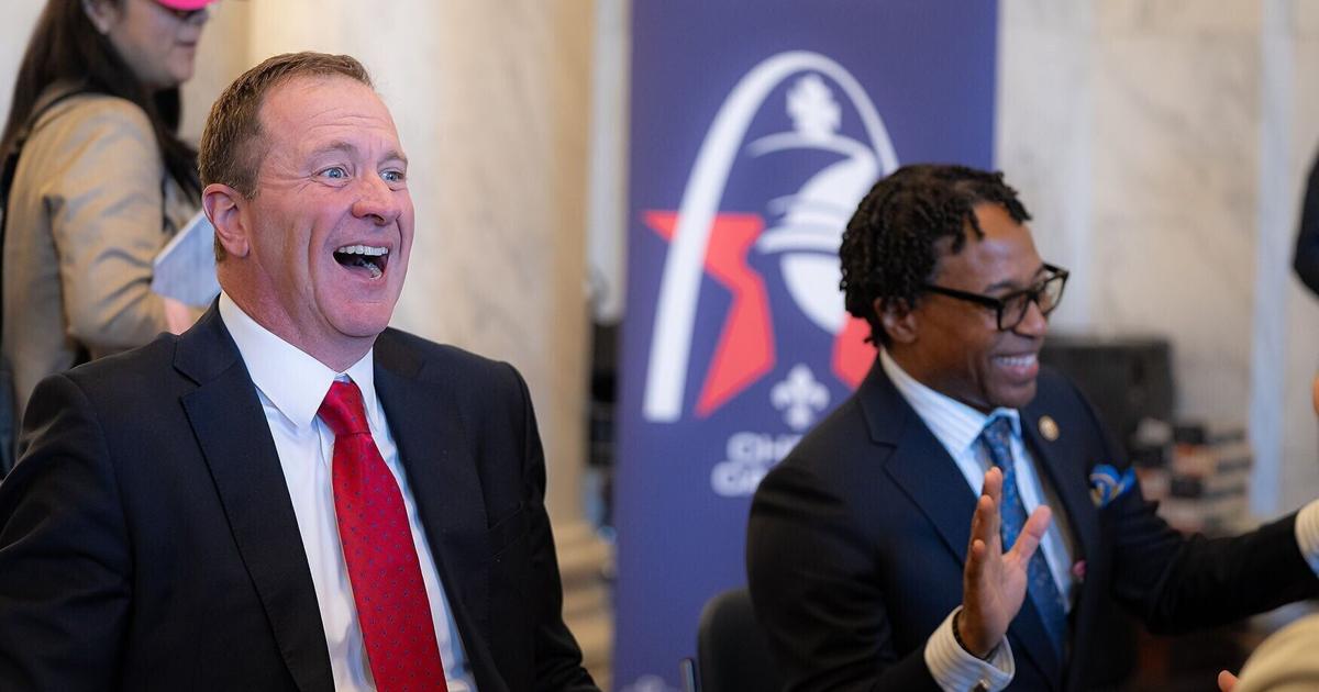 Sen. Eric Schmitt, R-Mo., left laughs with Rep. Wesley Bell, D-Mo