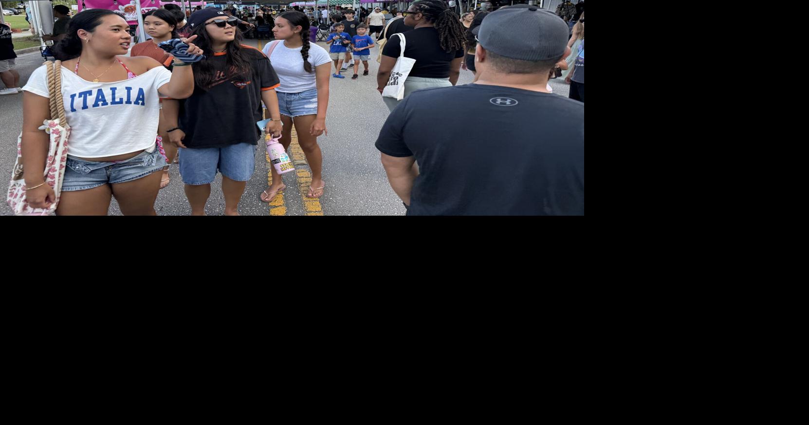 Block party celebrates 10 years of Mighty Purple café