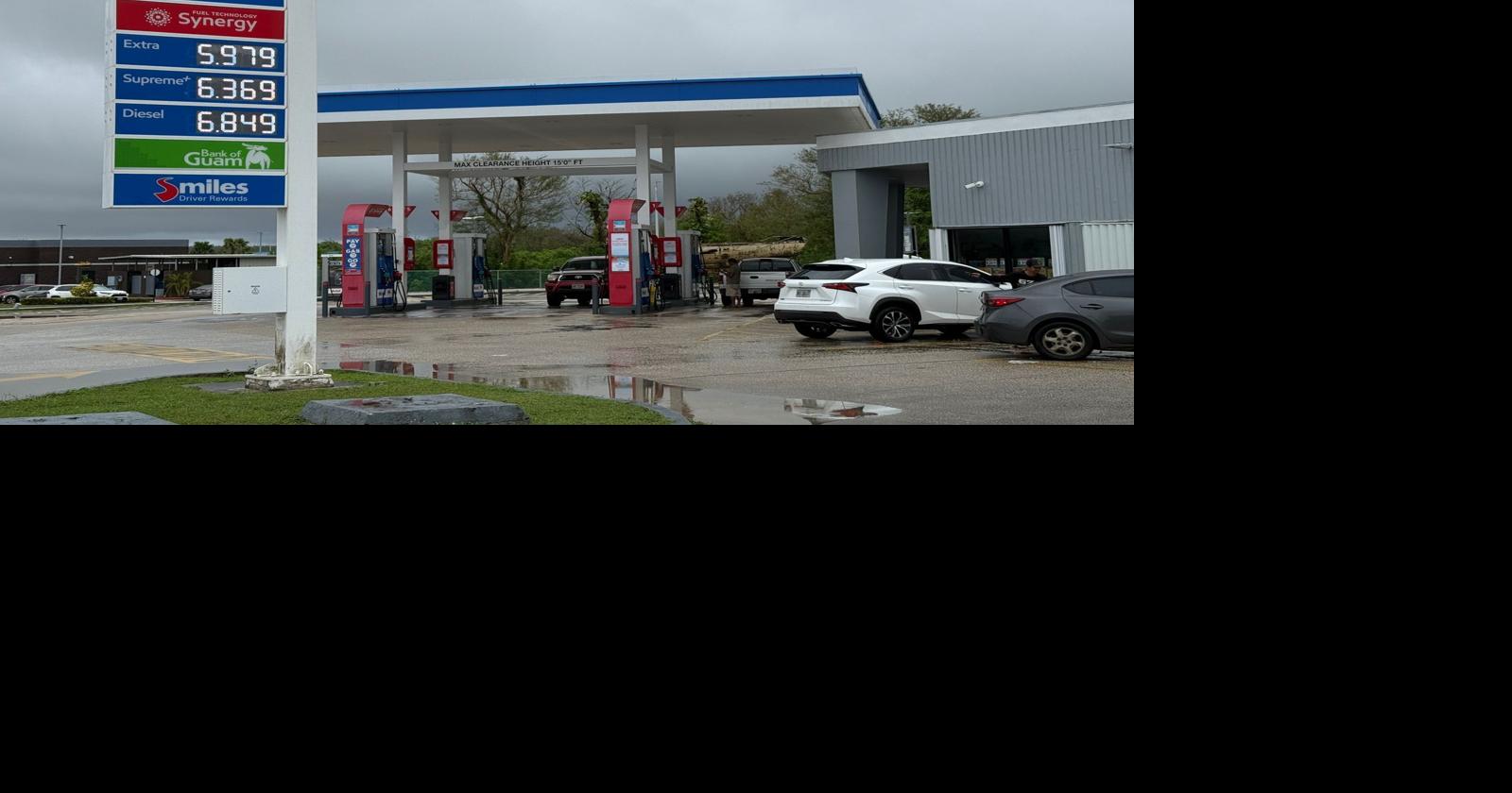 Regular gas drops 15 cents, below $6 again