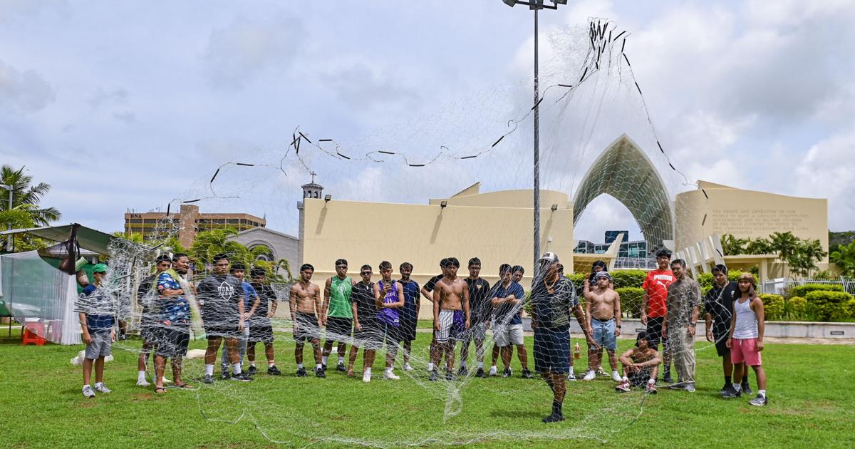 PHOTOS: Young men learn how to cast a fish net