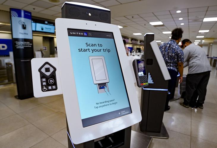 Universal Check In PHOTOS: United Airlines unveils new electronic check-in system ...