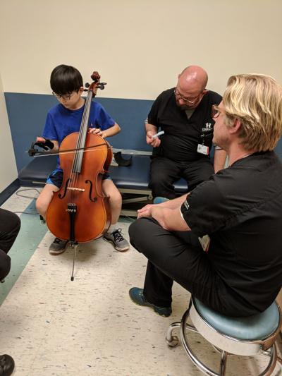 Twelve Year Old Gwinnett Boy Has Prosthesis Made To Help Him Play Cello News Gwinnettdailypost Com