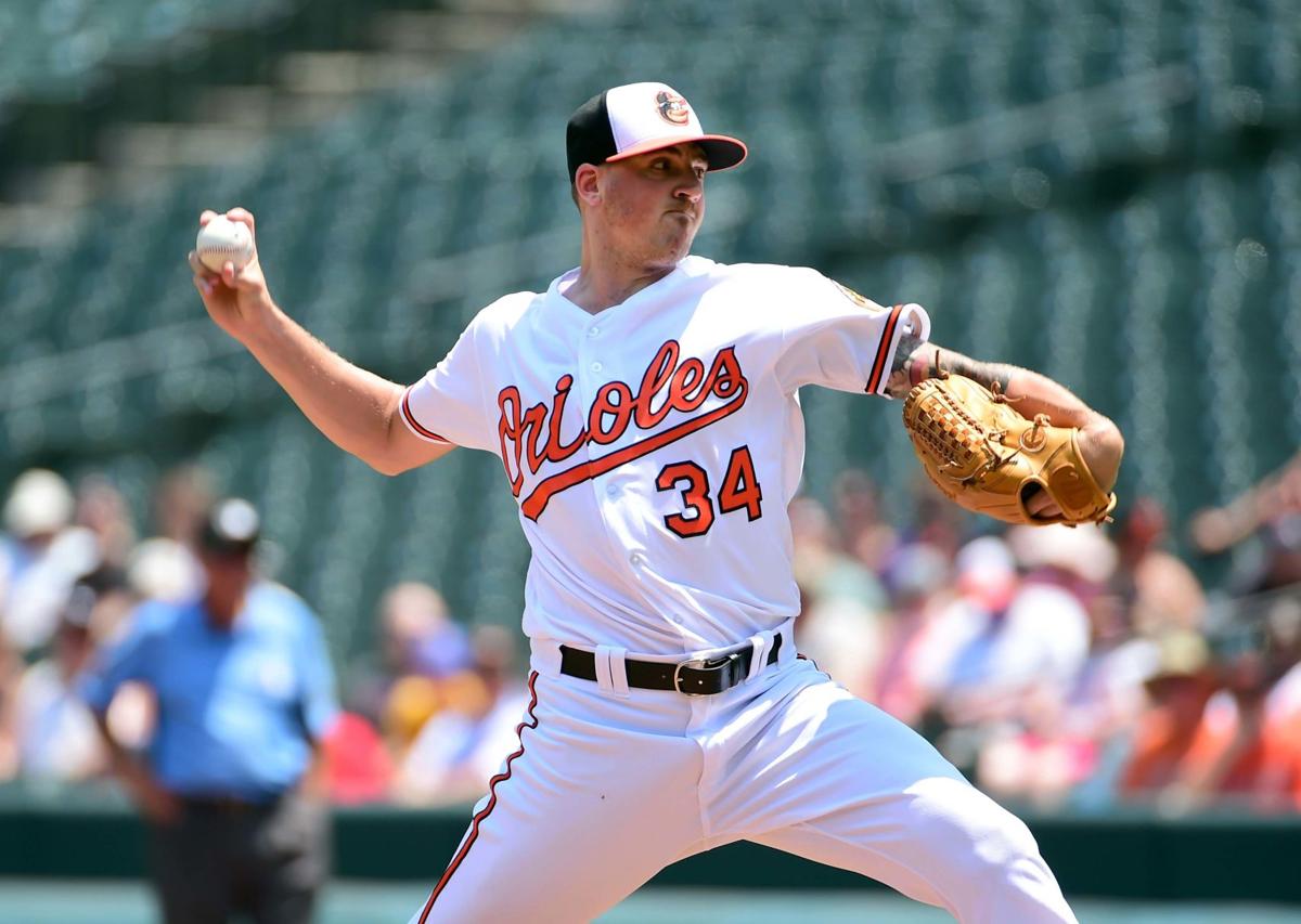 braves acquire two more pitchers from orioles via trade sports