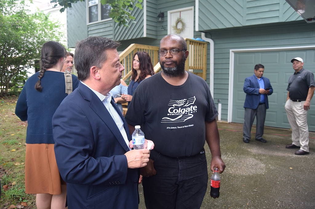 Lawrenceville family celebrates completion of home ownership program ...